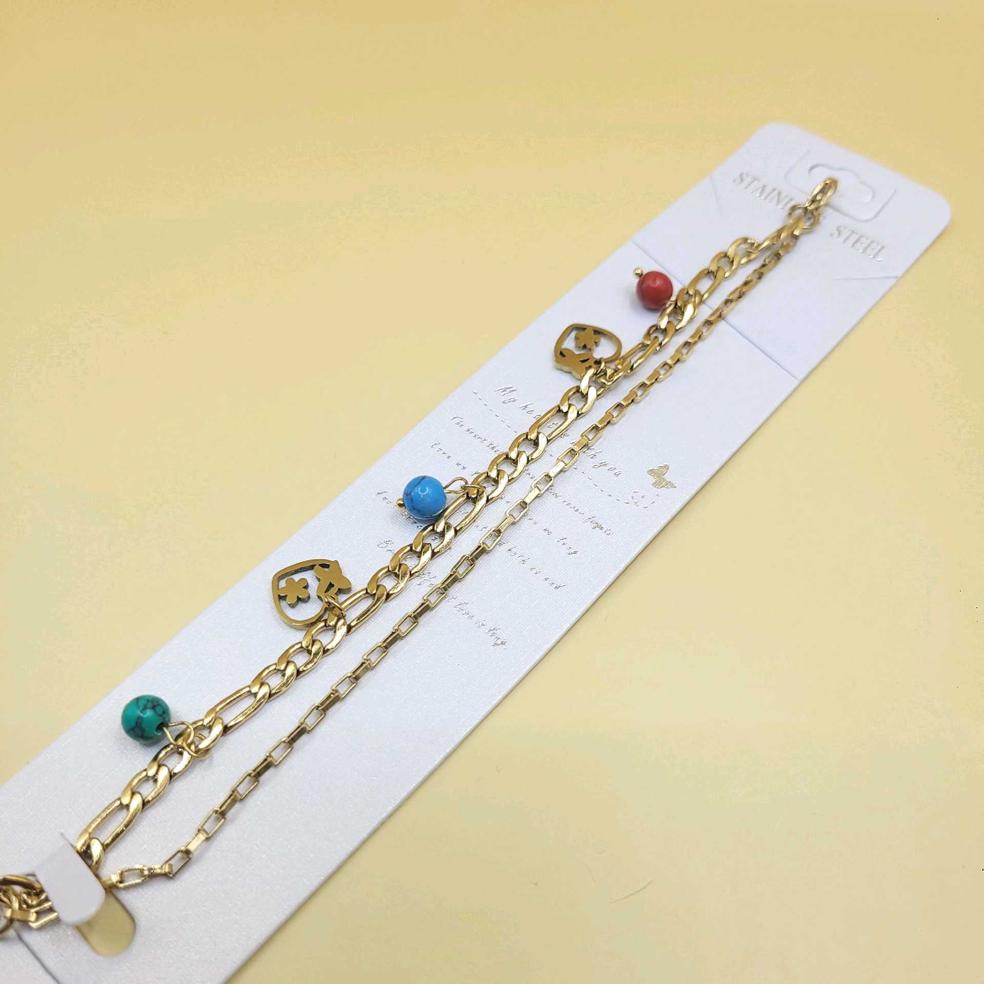 Pulsera bolitas y dijes corazón con mariposa y flor / acero inoxidable 