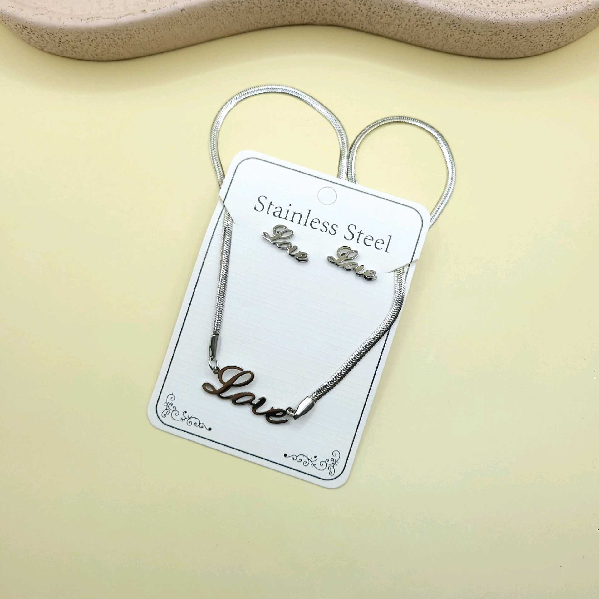 Juego love tono plata / acero inoxidable