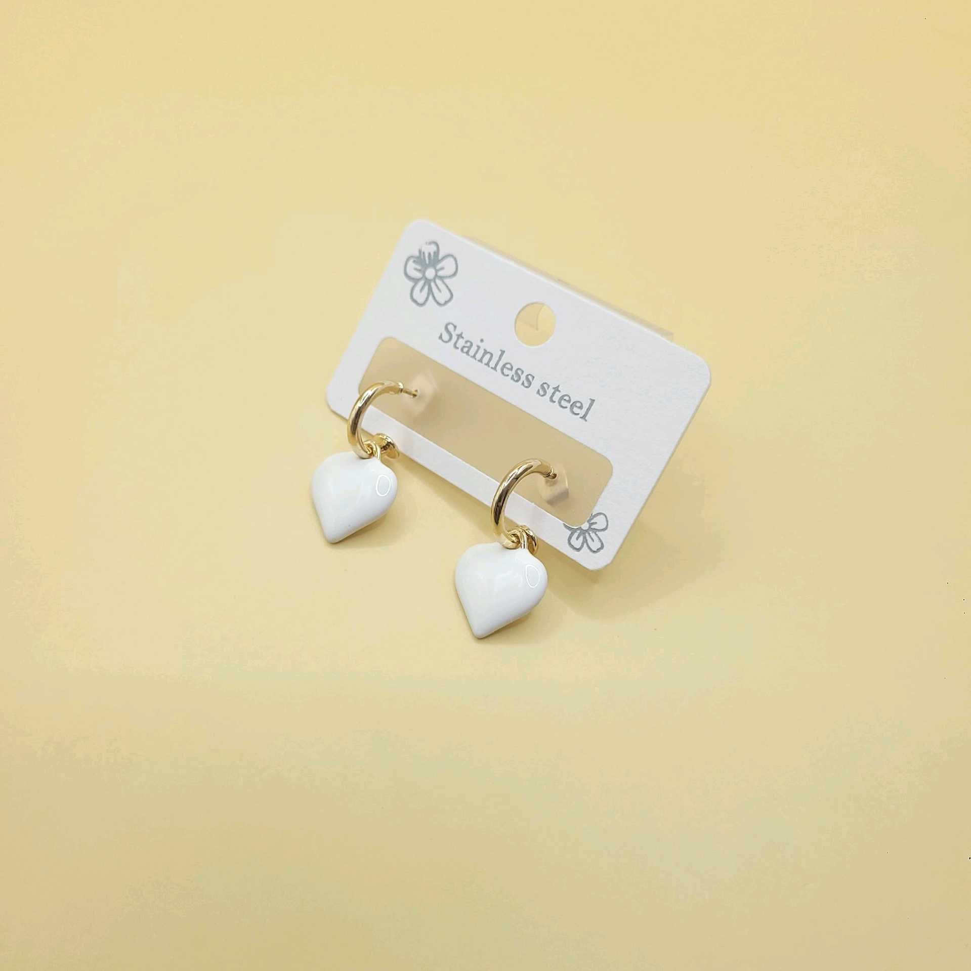 Aretes corazón blanco / bronce 