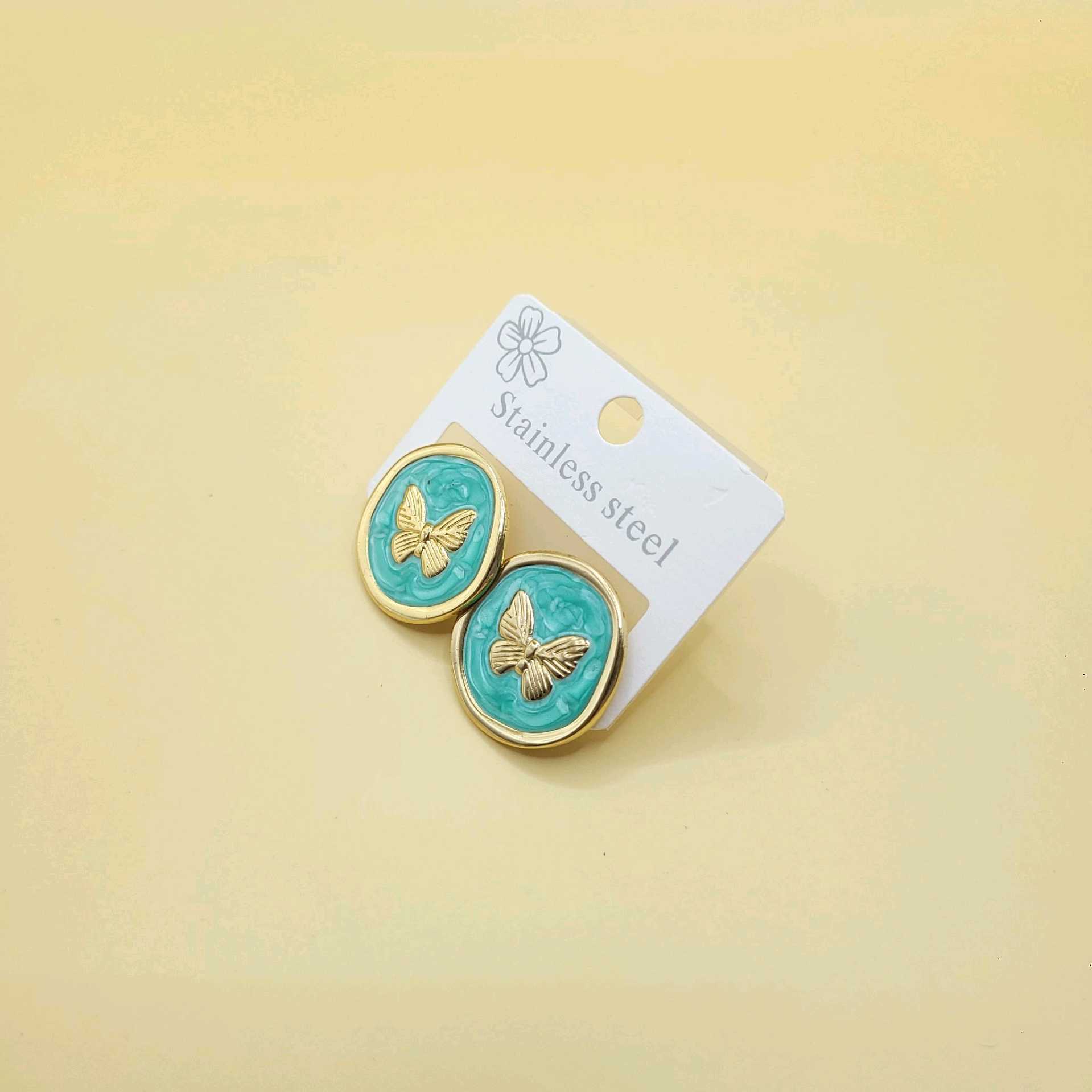 Aretes mariposas y esmaltado turquesa / acero inoxidable 