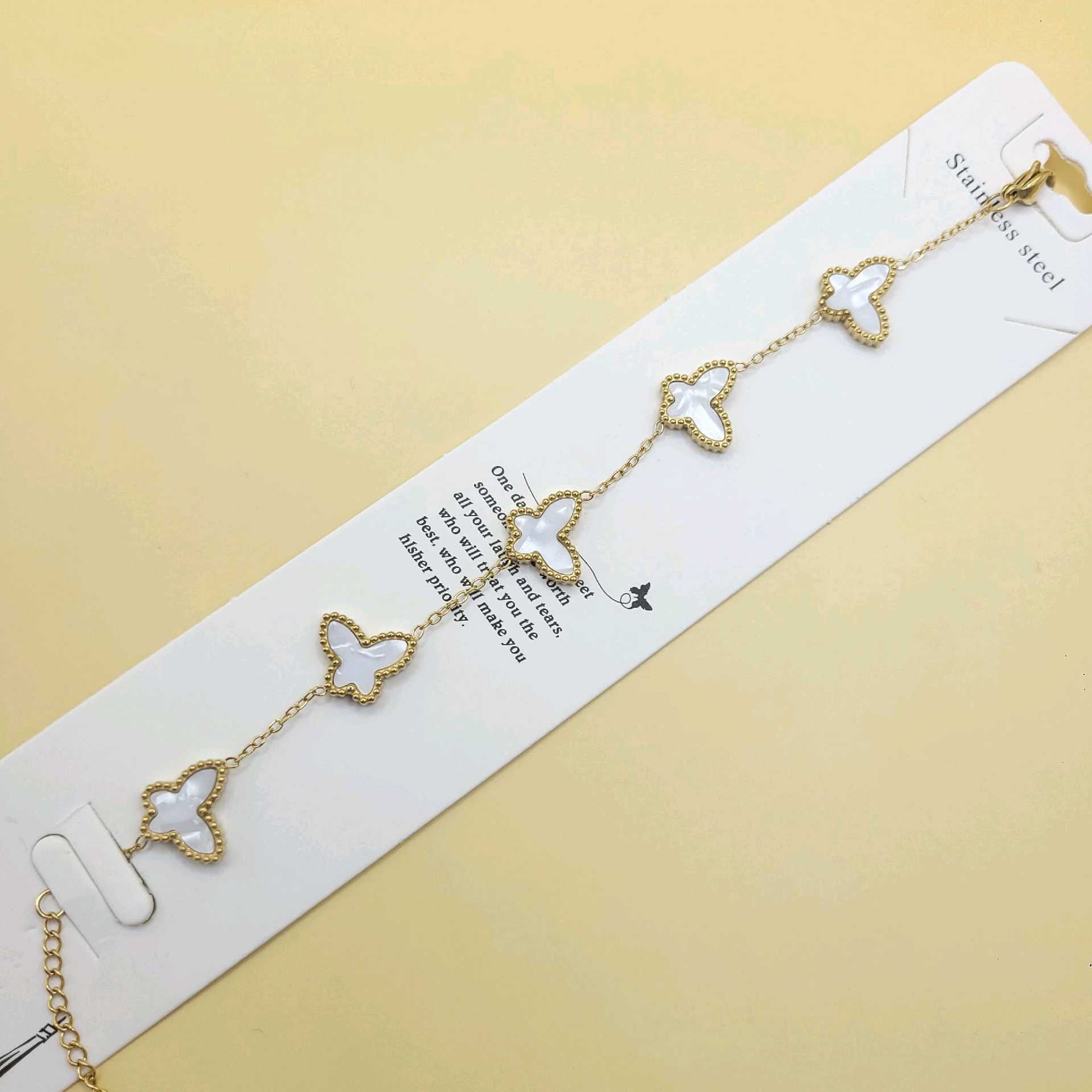 Pulsera mariposas blancas / acero inoxidable 