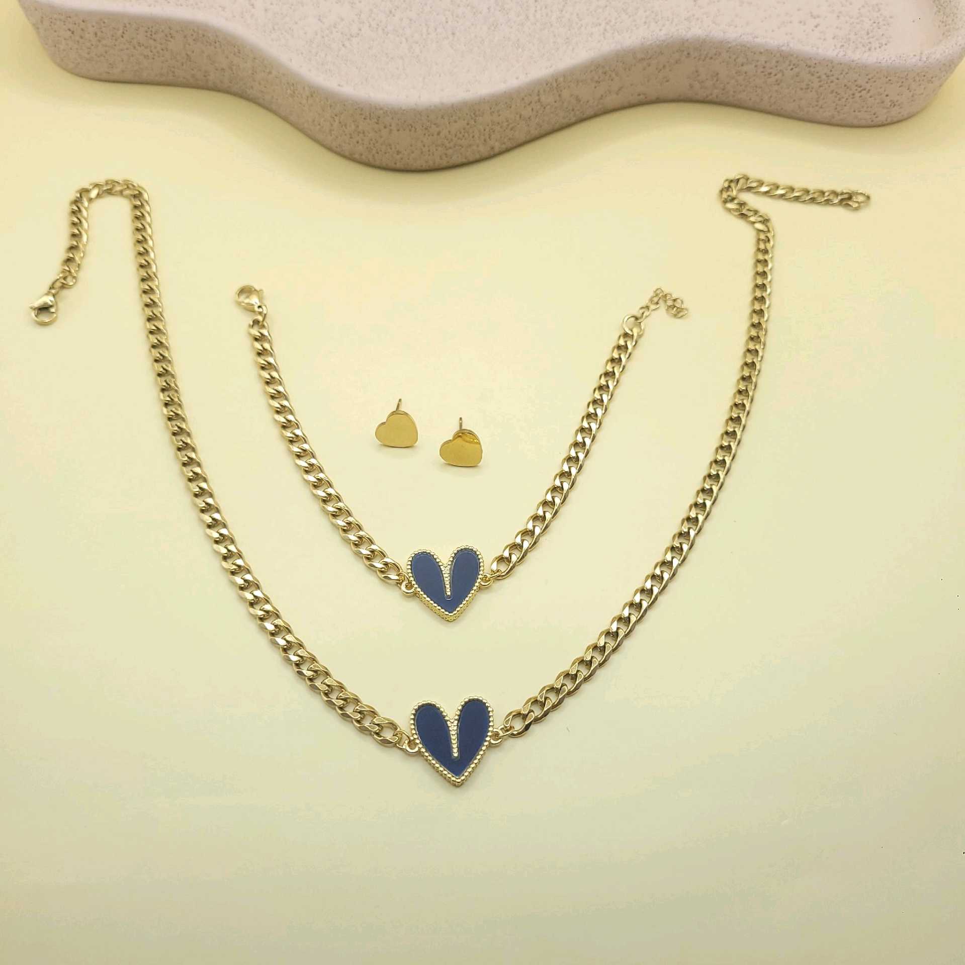 Juego corazones azules/ cadena acero y dije bronce 