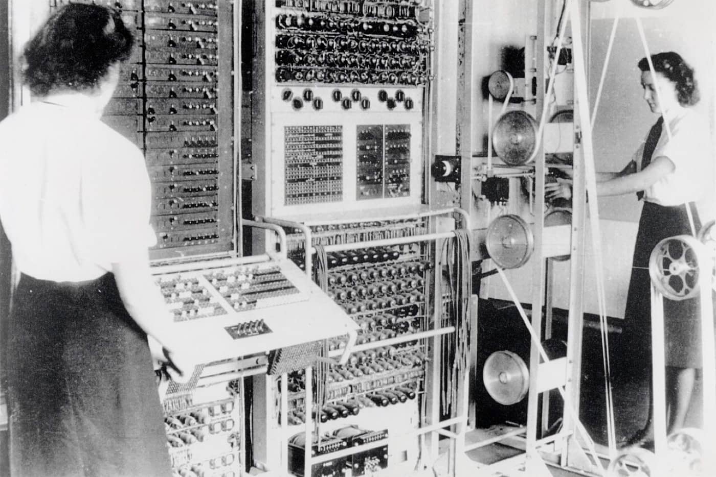Two women operate the Colossus codebreaking machine at Bletchley Park