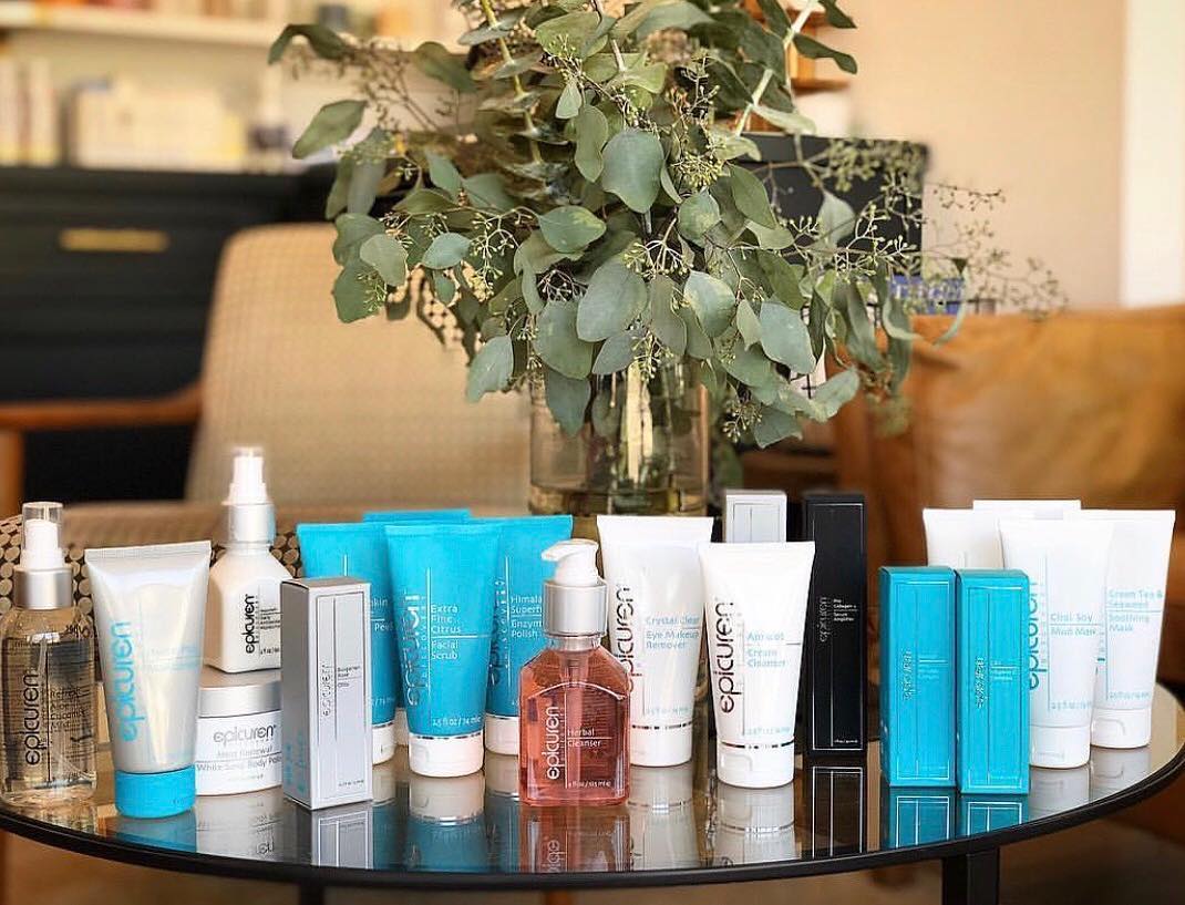 Epicuren products lined up on a coffee table.