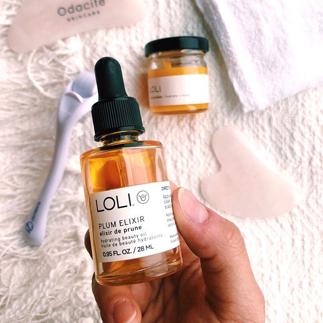 a bottle of LOLI beauty plum serum