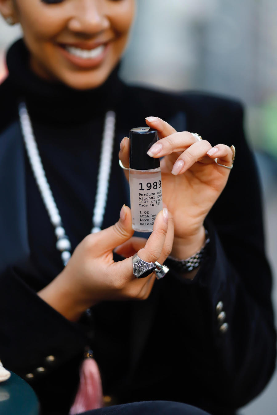 Alyssa Simone holds her 1989 perfume in both hands.