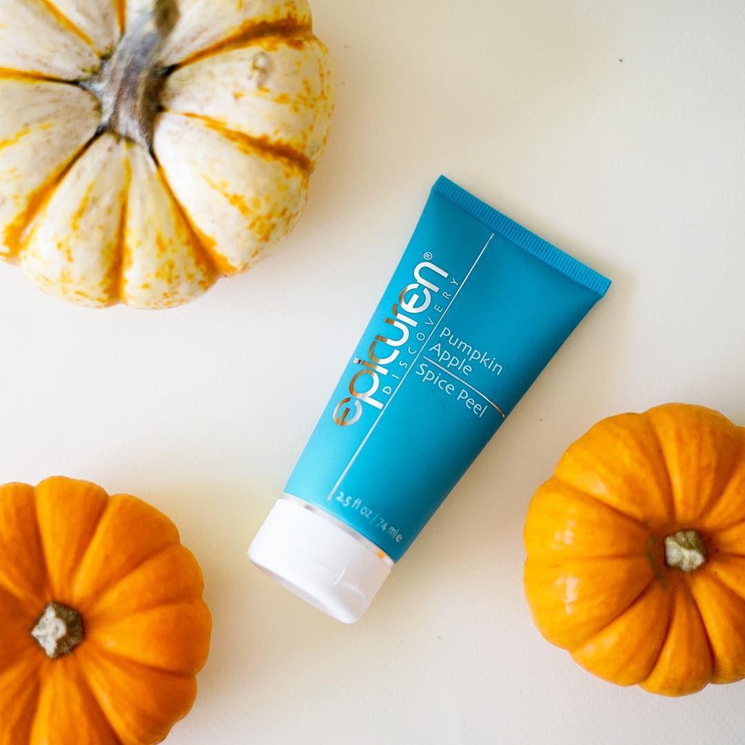 Epicuren's pumpkin apple spice peel laid flat on a white background surrounded by three pumpkins.
