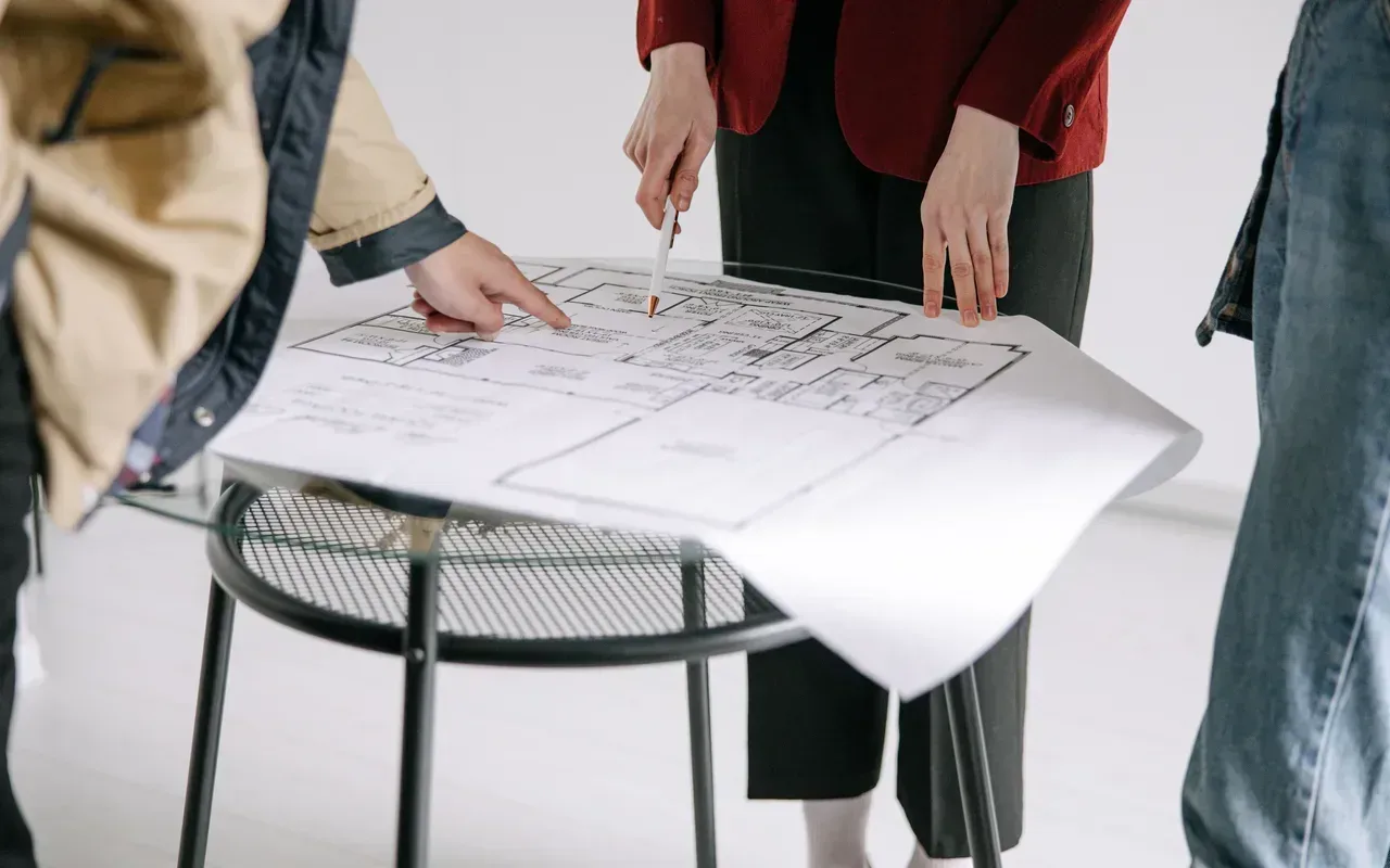 People reviewing blueprint