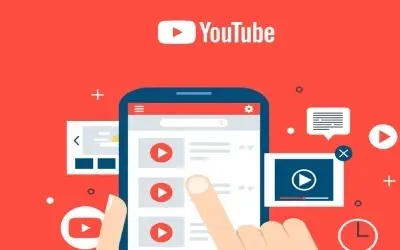  Ilustracija ruke koja bira video na ekranu pametnog telefona, sa YouTube logotipom u pozadini.