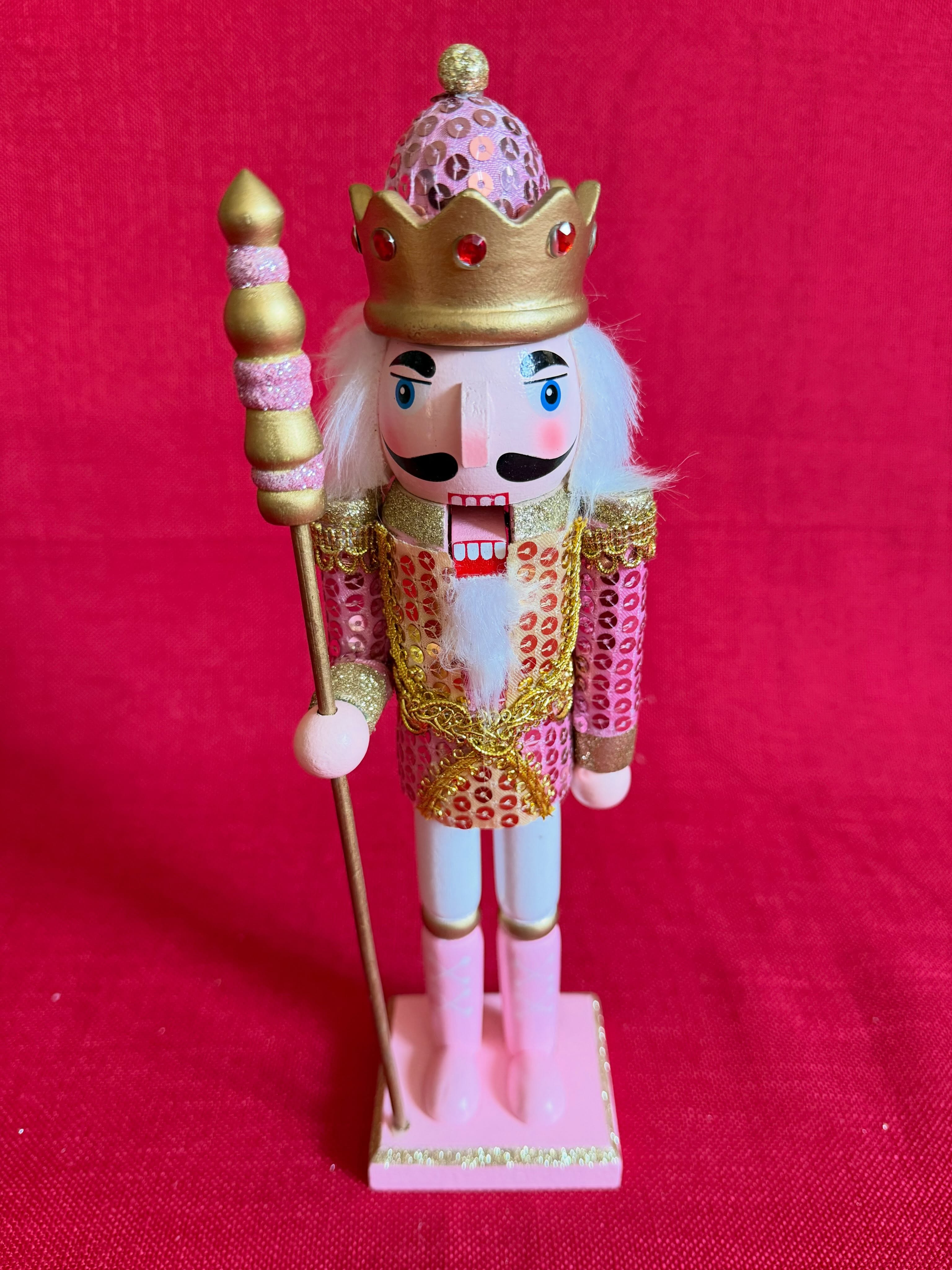Adorno navideño de cascanueces dorado y rosado