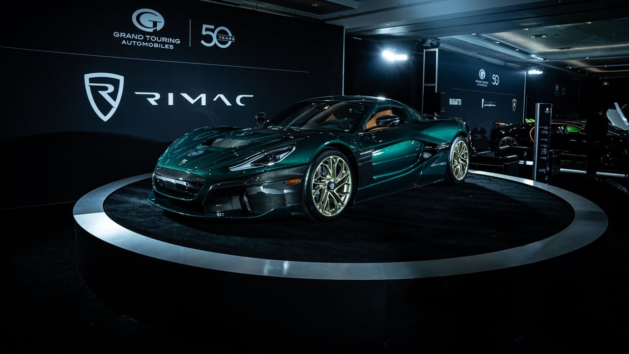 A Rimac electric sports car on display at an automotive event, showcasing sleek design and innovation.