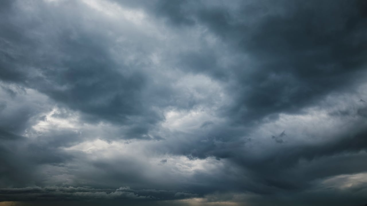 Moody sky with thick storm clouds, capturing the essence of an approaching storm.