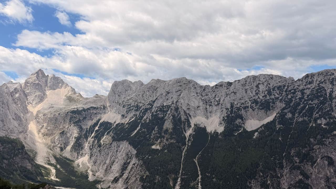 Stunning view of the Julian Alps under a cloudy sky, showcasing natural beauty.
