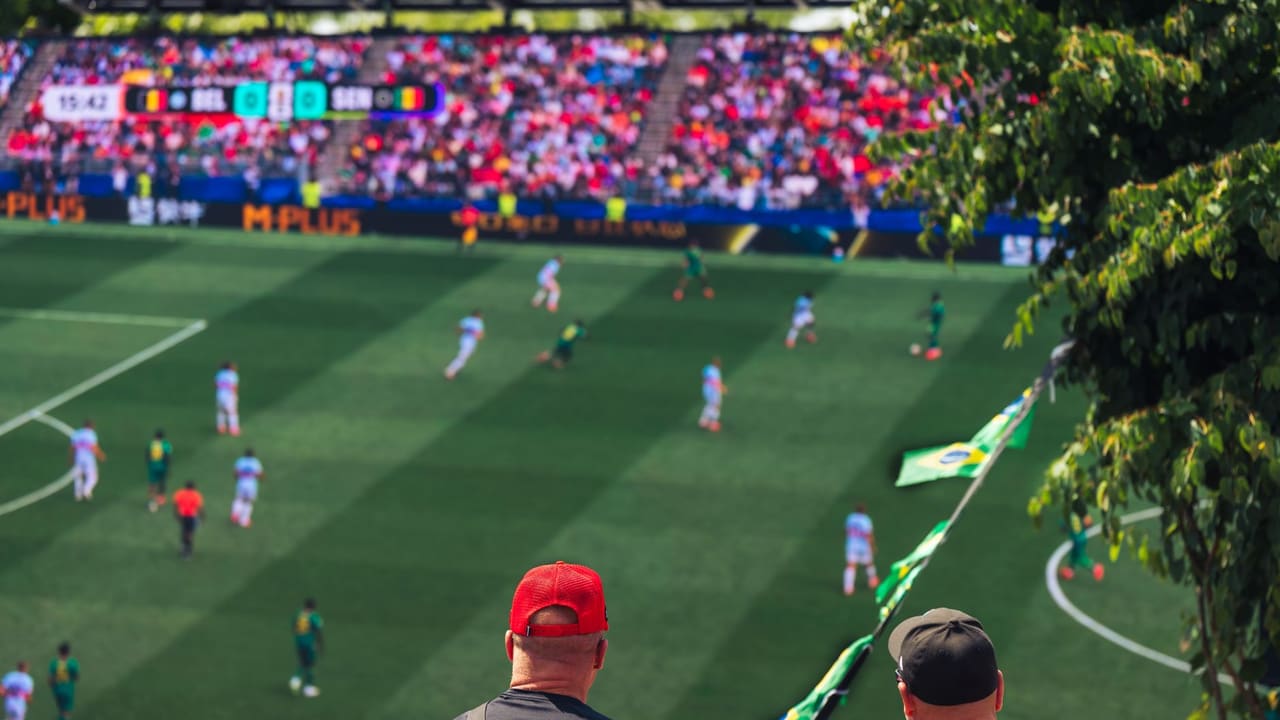 Engaging view of soccer fans enjoying a live match at a stadium in Langford, BC, Canada.