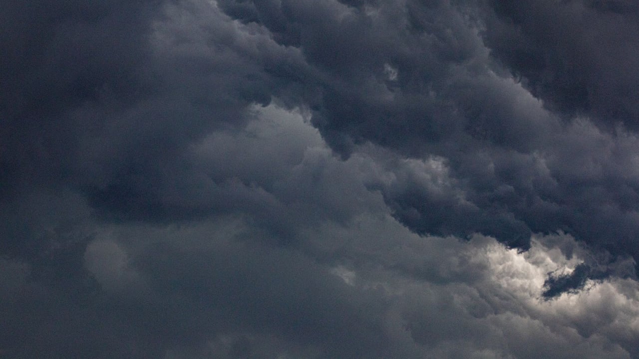 Moody sky filled with dense, dark clouds representing a dramatic atmosphere.