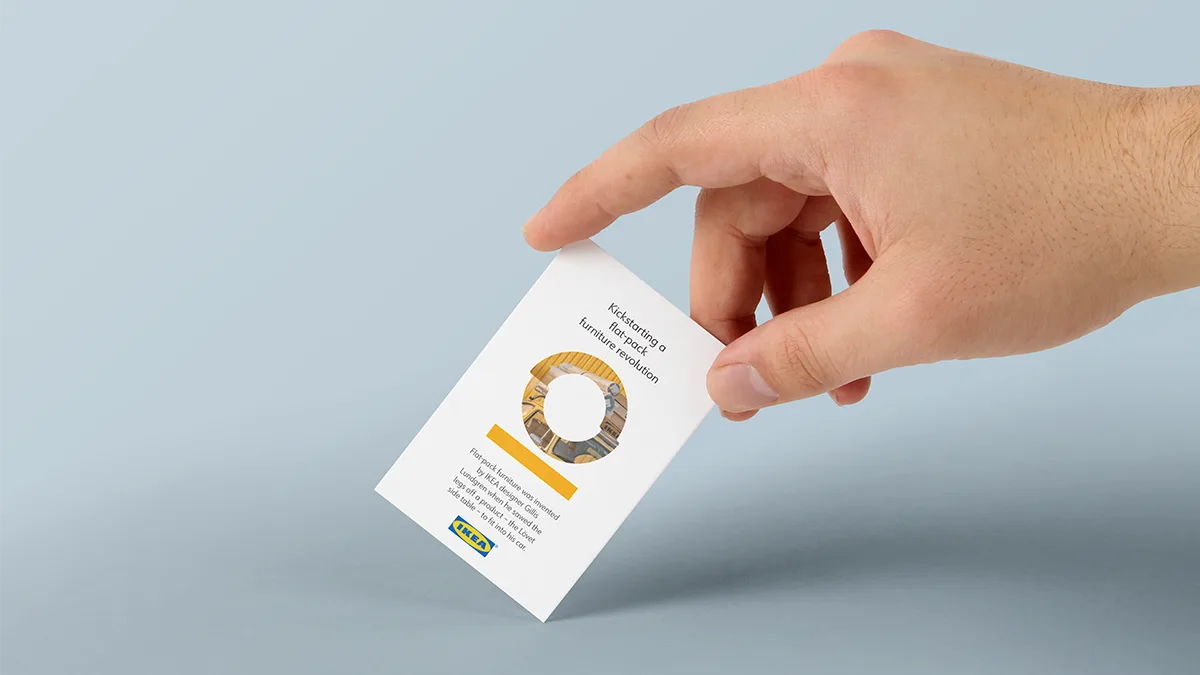 Hand holding an IKEA Beyond business card with a personalized innovation story.