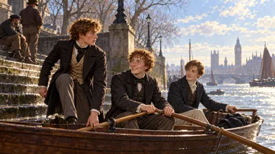 Three young men board a rowing boat at wet stone river stairs on a bright cold morning, one taking the tiller with a bag beside him, while watermen loiter on the steps.