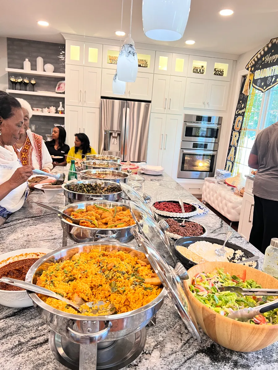 Vibrant buffet spread featuring colorful dishes, fragrant rice, fresh salads, and an inviting kitchen atmosphere.