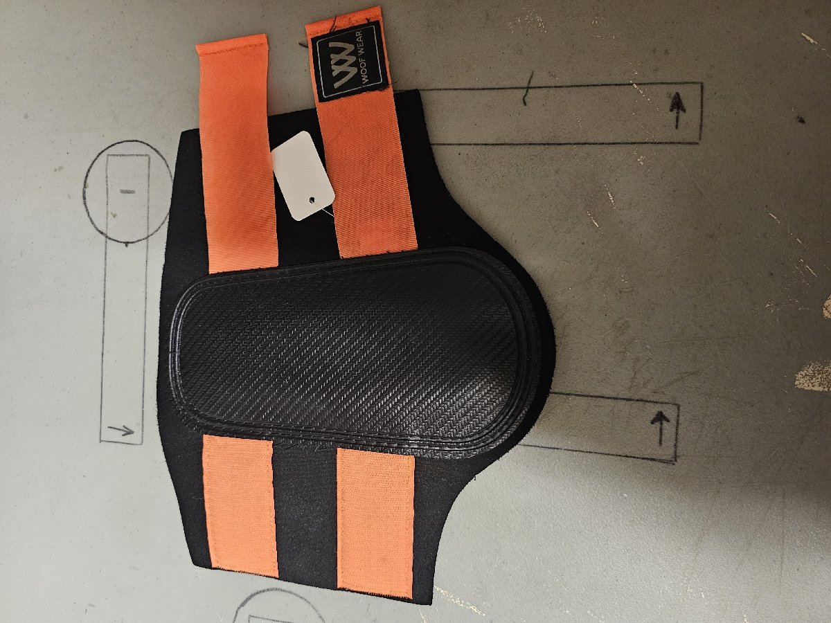 Large orange and black Woof Wear brushing boots Large