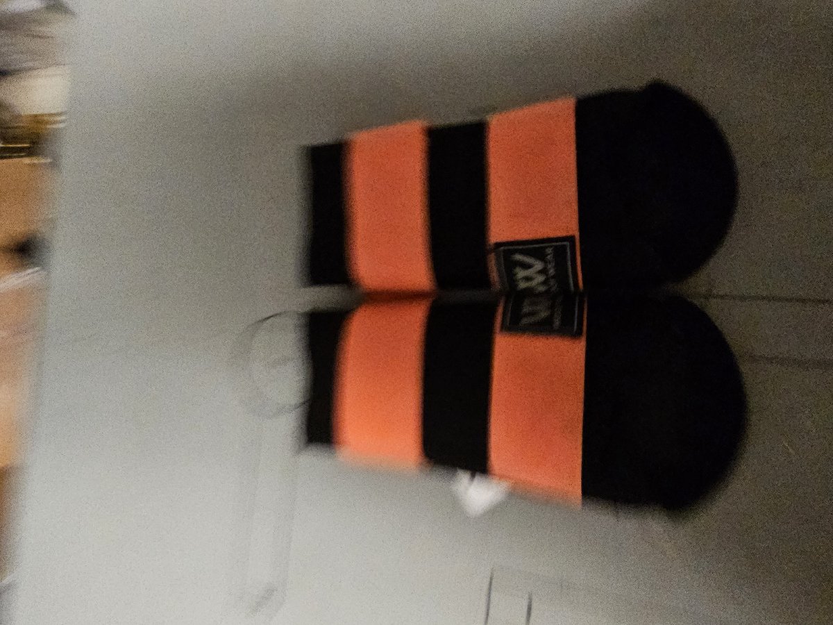 Large orange and black Woof Wear brushing boots Large