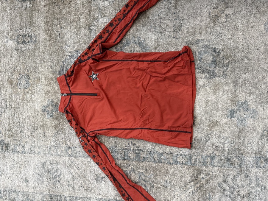  Orange Lemieux size 11/12 long sleeve with stars on them 