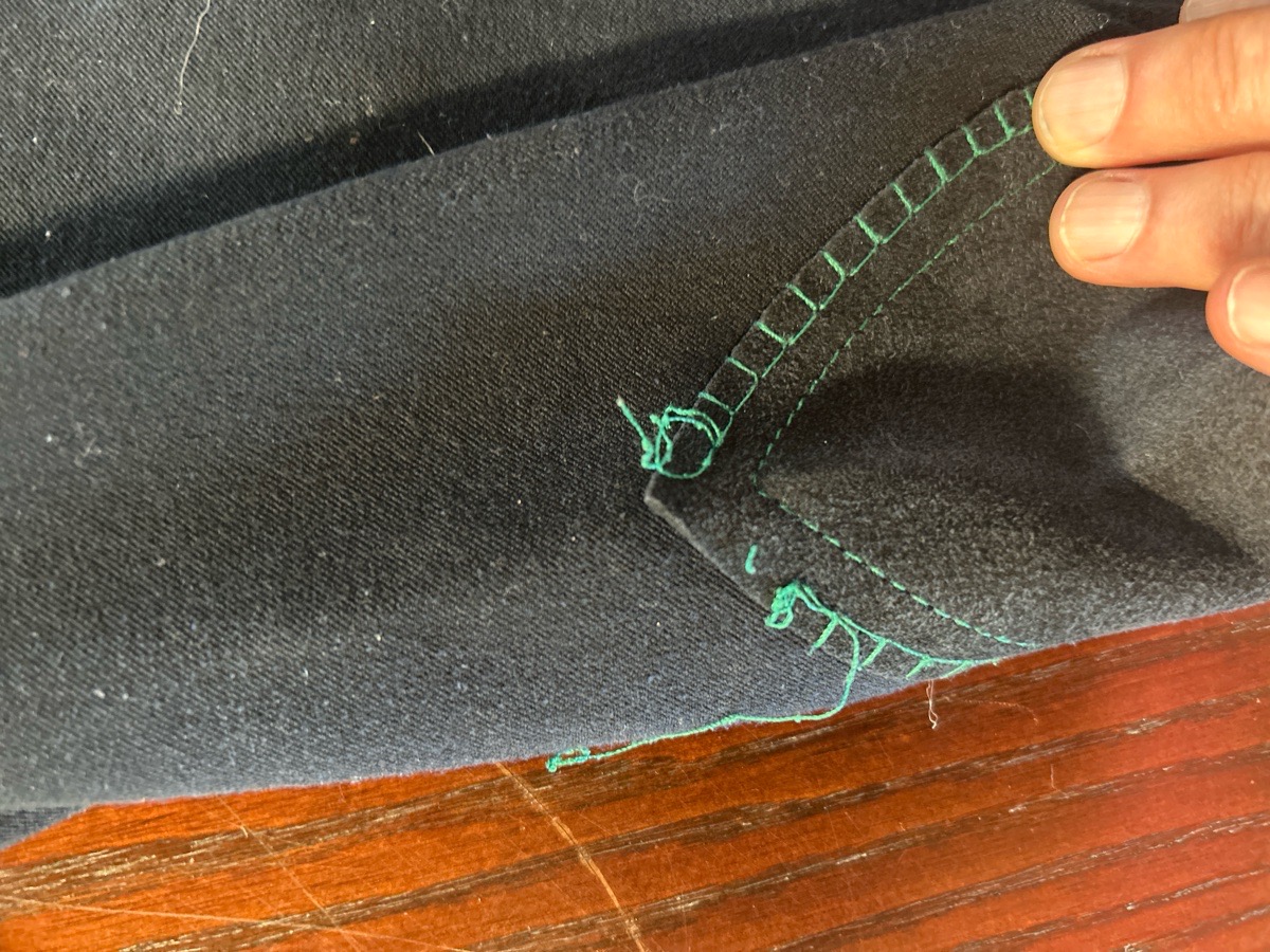 Navy piper reaches with emerald embroidery , around size 26