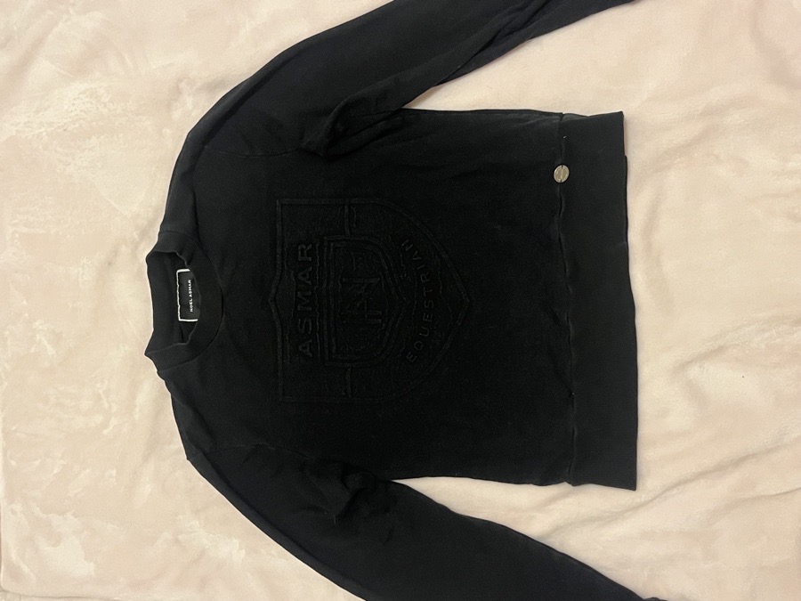 Noel Asmar riding black longsleeve