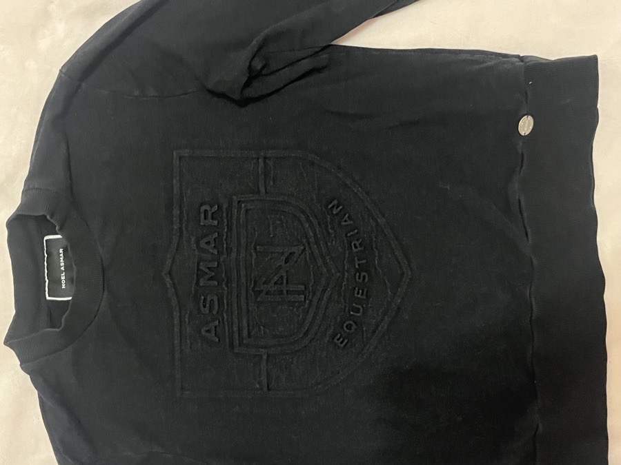 Noel Asmar riding black longsleeve