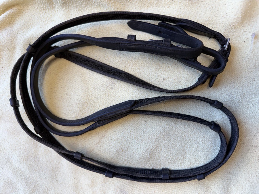 49” black pony rubberized web reins with handstops