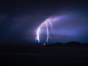 Lightning off of the Marin coast, looking from the Golden Gate Bridge.