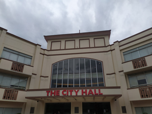 a building with a sign that says the city hall