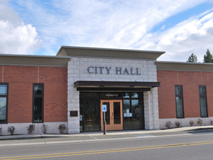 a brick building with a sign that says city hall