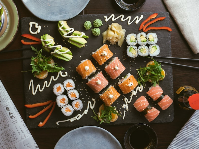 sushi on black ceramic plate