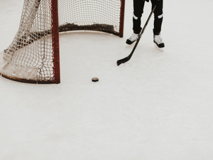 person playing ice hockey
