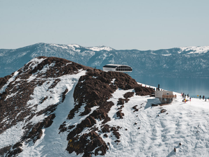 white and black building on snow covered mountain during daytime