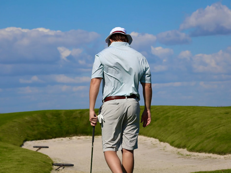 Man contemplates shot standing over bunker