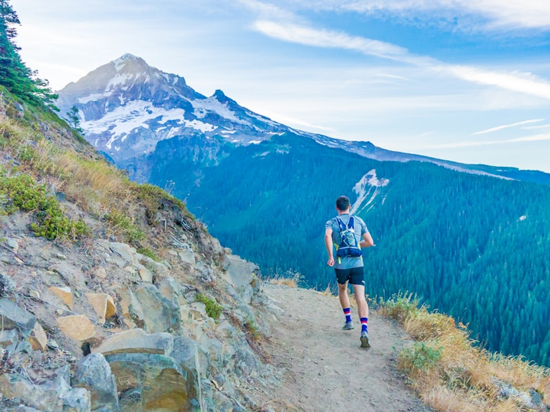 It seemed like a crazy dream: could we run a 43 mile hiking route in one day? Neither of us had ever tried such an ambitious adventure.    Here, my friend spots the mountain for the first time.    We made it around!
