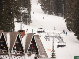 A ski lift going up the side of a mountain