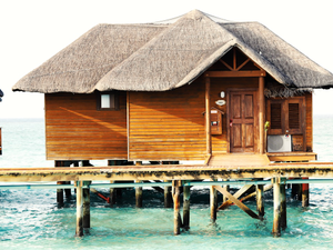 a wooden dock in front of a house