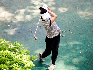 a person holding a golf club