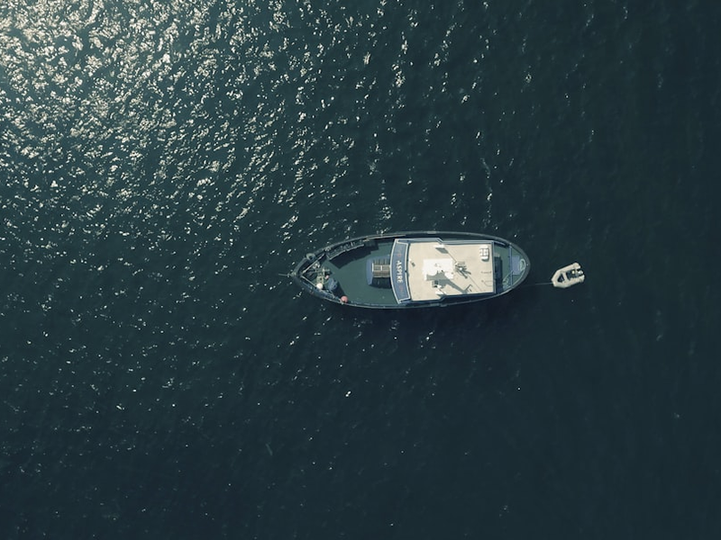 aerial photography of sailing boat in water
