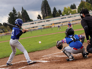 Youth baseball player about to hit a baseball at the plate