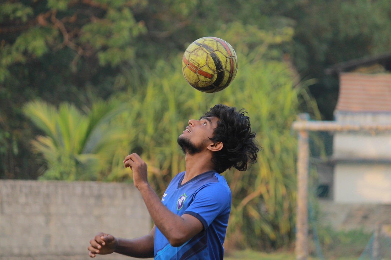 Football player juggling ball