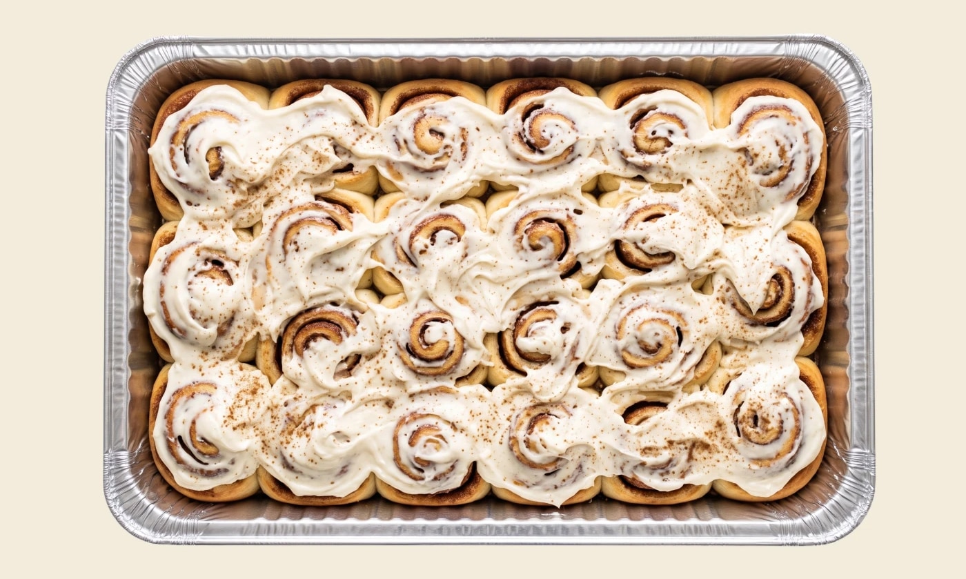 swole roll catering tray — a sheet pan of frosted high-protein cinnamon rolls, catered for twin cities events
