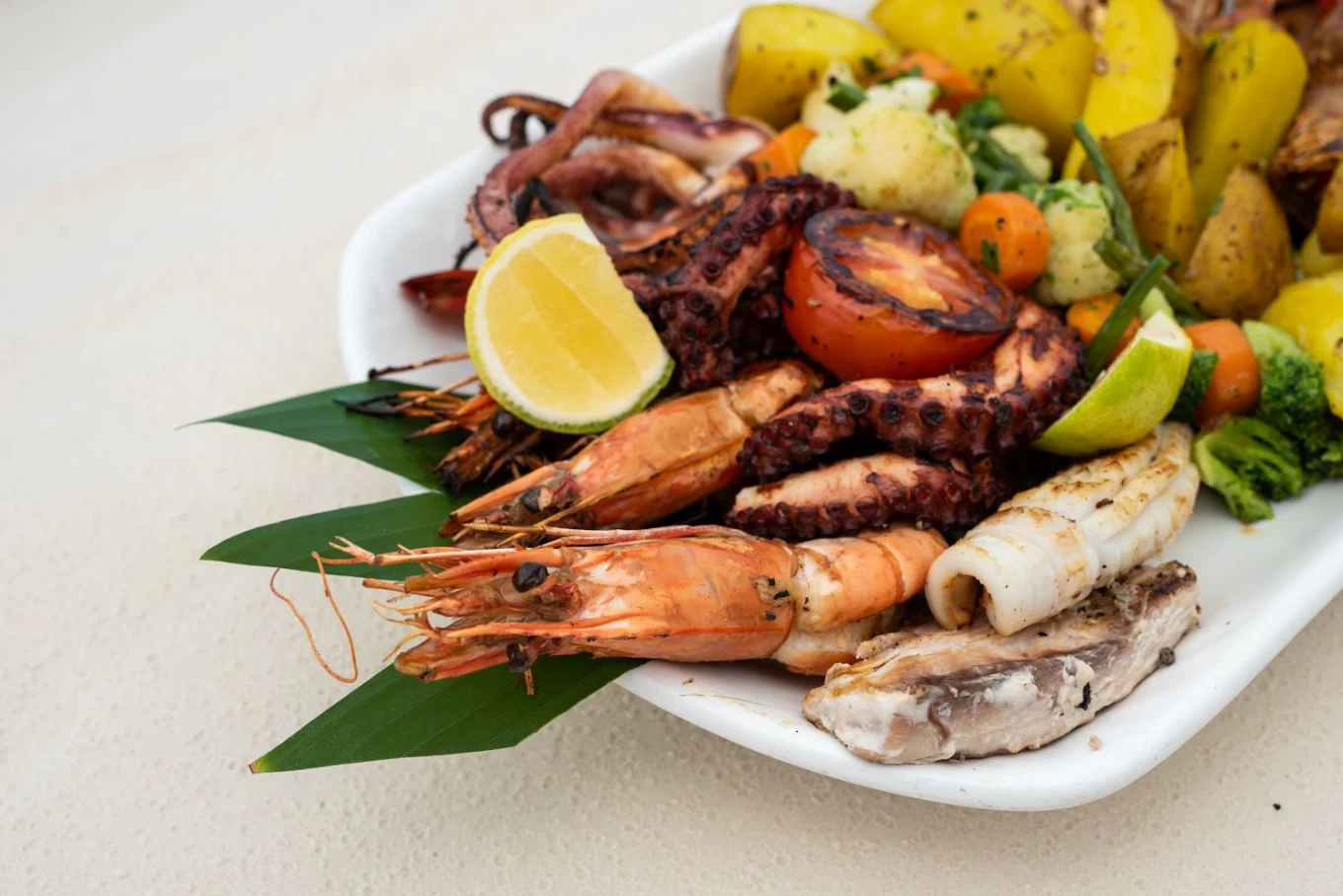 Freshly prepared gourmet seafood and grilled prawns served at Nungwi Dreams by Mantis