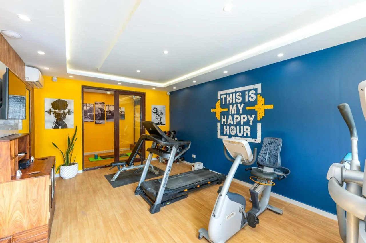 Modern indoor gym equipped with treadmills and fitness training machines.