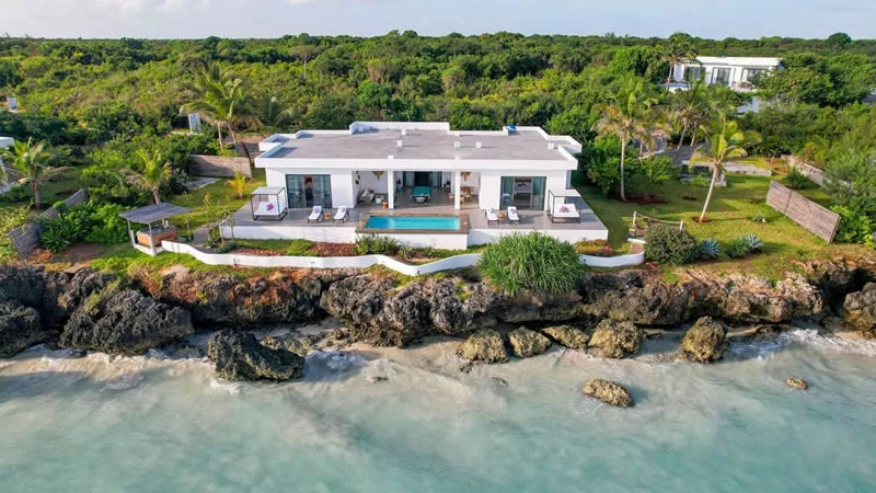 Luxury beachfront villa with private pool nestled along the coast in Zanzibar.