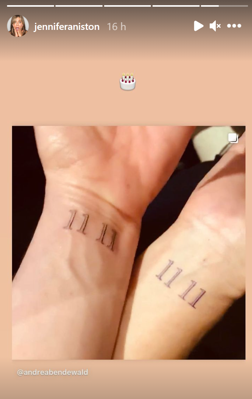 Jennifer Aniston and Andrea Bendewald showing matching fine-line 11 11 inner-wrist tattoos
