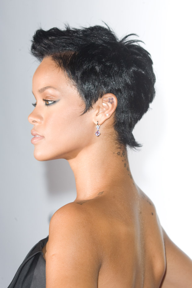 Rihanna in left profile, with a small star visible inside her upper left ear.
