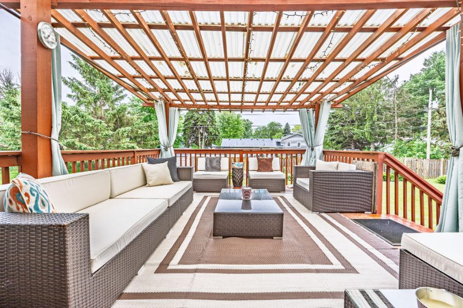 Covered outdoor living space photographed for a Twin Cities listing